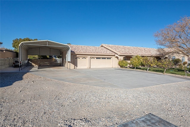 view of front of house with a garage and a carport