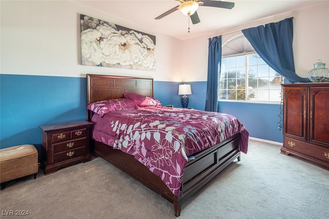 bedroom with light carpet and ceiling fan