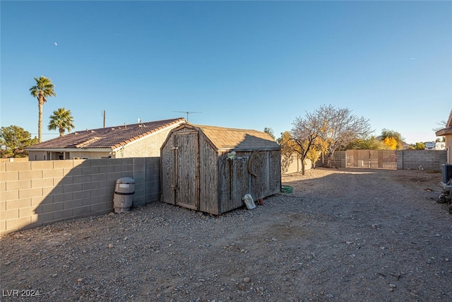 exterior space with a shed