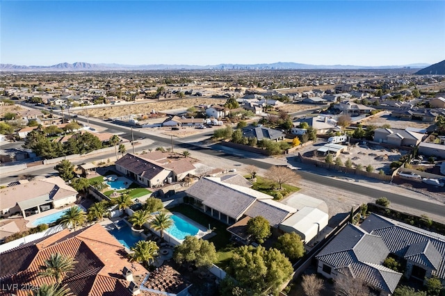 drone / aerial view featuring a mountain view