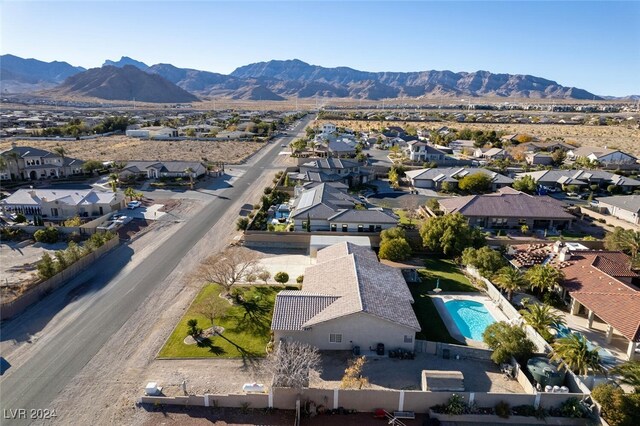 birds eye view of property with a mountain view