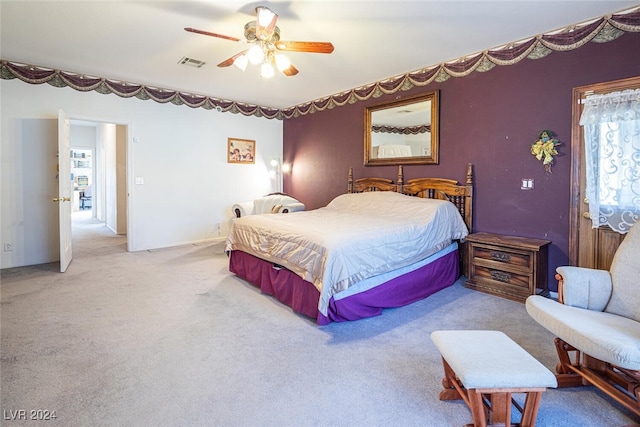 bedroom with light colored carpet and ceiling fan