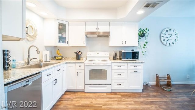 kitchen with light stone counters, sink, stainless steel appliances, and white cabinets