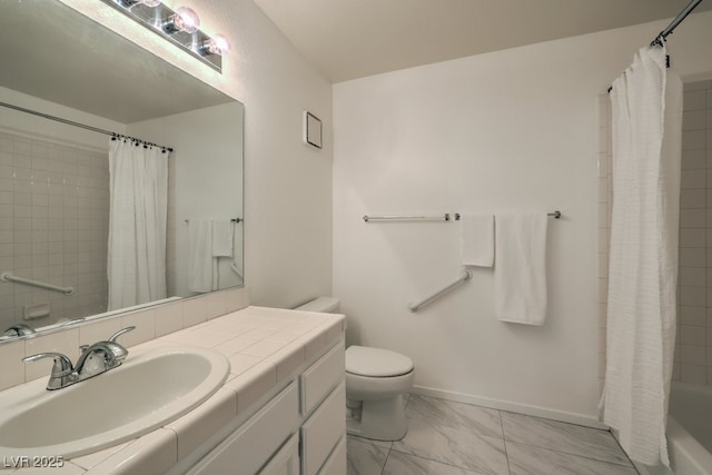 bathroom with baseboards, toilet, marble finish floor, shower / bath combo with shower curtain, and vanity