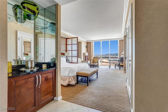 interior space with expansive windows and ornamental molding