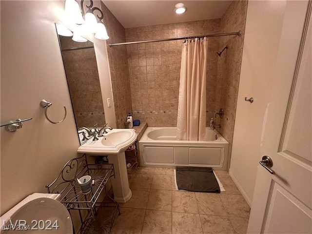 bathroom with toilet, tile patterned floors, and shower / bathtub combination with curtain