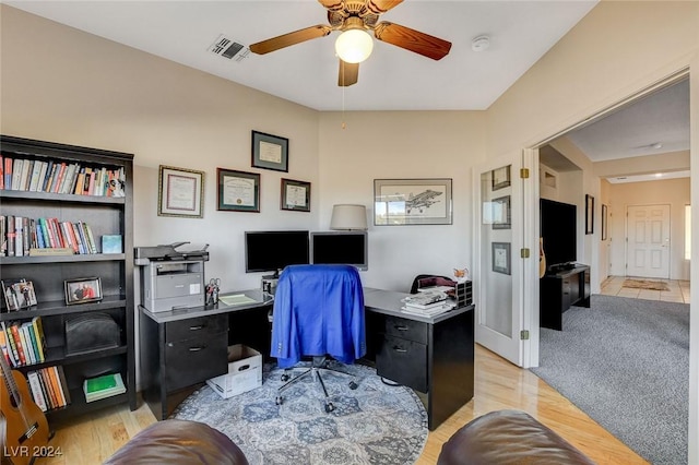 home office featuring ceiling fan and light wood-type flooring