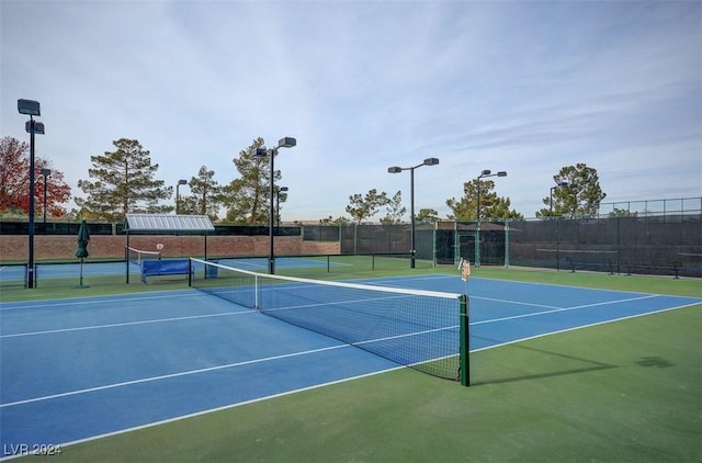 view of tennis court with basketball court