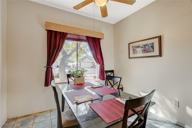 dining room featuring light tile patterned floors and ceiling fan