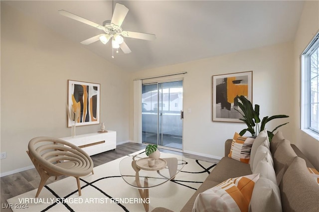 living room with hardwood / wood-style flooring, vaulted ceiling, and a healthy amount of sunlight