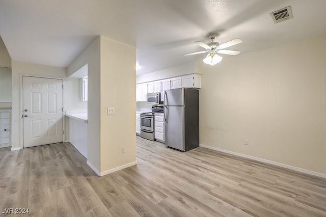 kitchen featuring ceiling fan, light hardwood / wood-style flooring, stainless steel appliances, and white cabinets