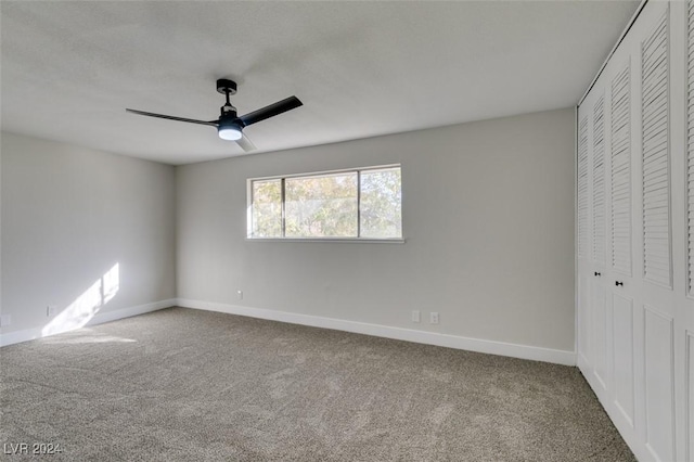 unfurnished bedroom with ceiling fan, a closet, and carpet floors