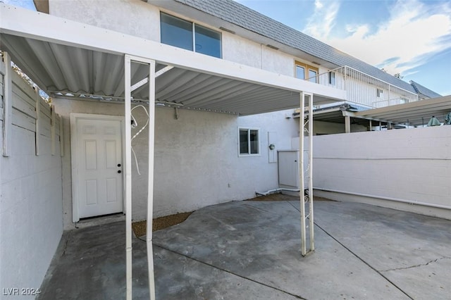 view of patio featuring a carport