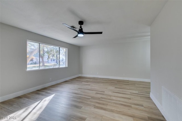 spare room featuring ceiling fan and light wood-type flooring