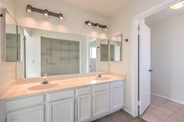 bathroom featuring tile patterned floors and vanity