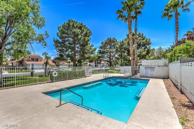 view of swimming pool with a patio