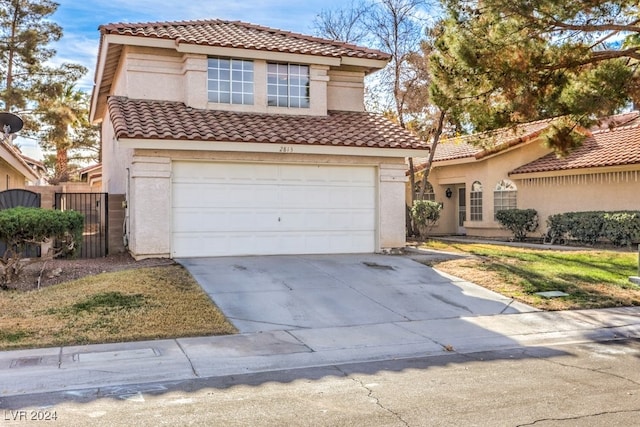 mediterranean / spanish-style house featuring a garage