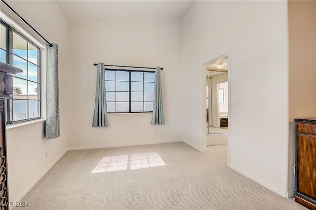 empty room featuring light colored carpet