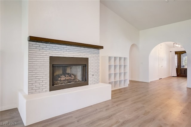 unfurnished living room featuring a fireplace and light wood-type flooring