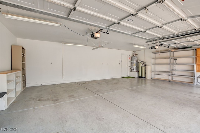 garage featuring secured water heater and a garage door opener