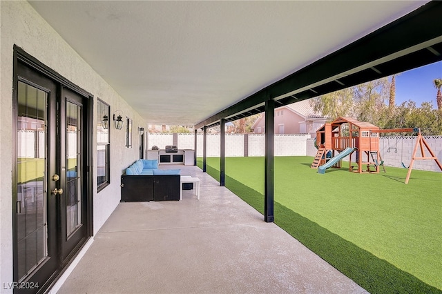 view of patio with french doors, an outdoor hangout area, and a playground