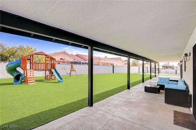 view of patio / terrace featuring outdoor lounge area and a playground