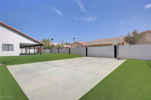 view of patio with basketball hoop