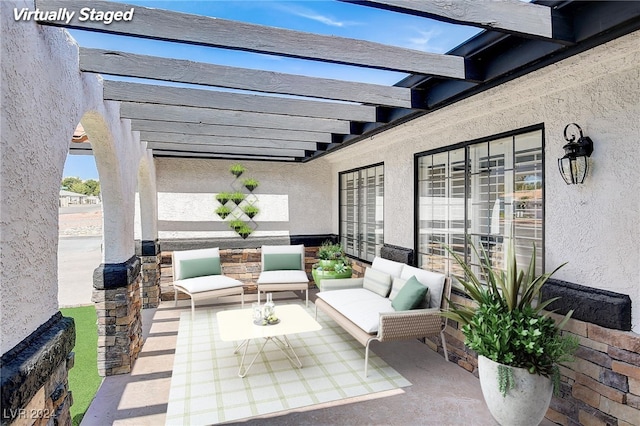 view of patio / terrace with a pergola and an outdoor living space