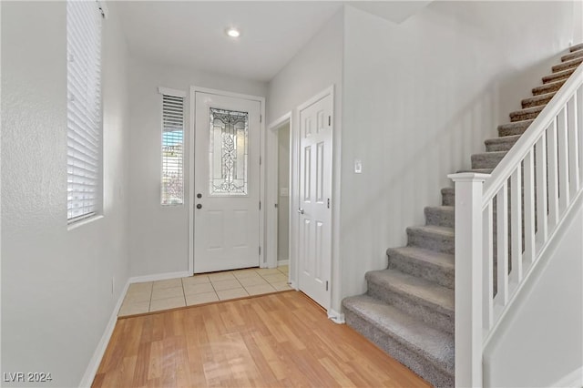 entryway with light hardwood / wood-style flooring