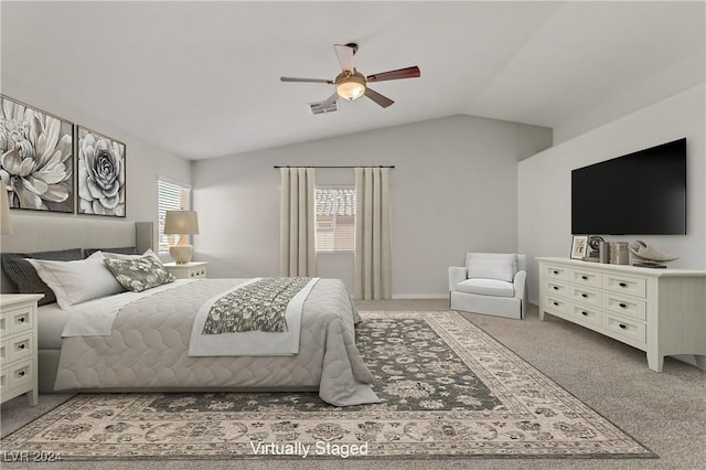 carpeted bedroom featuring ceiling fan and lofted ceiling