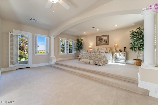 unfurnished bedroom featuring access to outside, ceiling fan, and light colored carpet