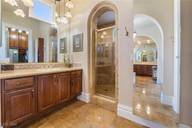 bathroom with vanity and an enclosed shower