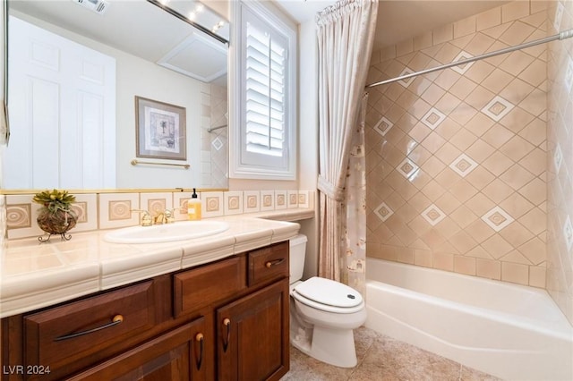 full bathroom with tasteful backsplash, vanity, shower / tub combo with curtain, tile patterned flooring, and toilet