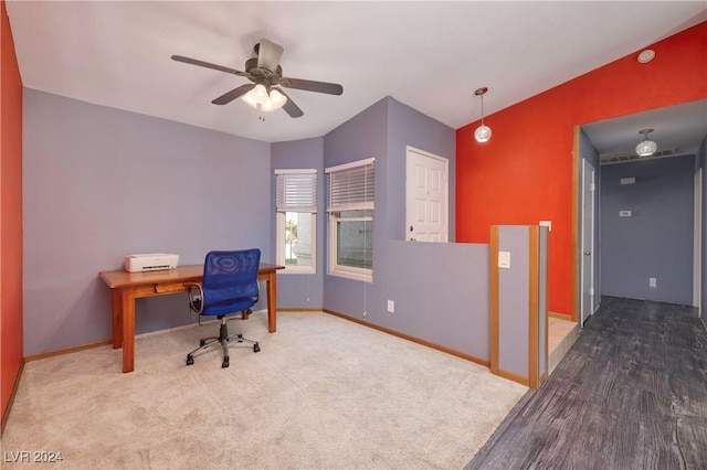 home office with hardwood / wood-style floors, ceiling fan, and vaulted ceiling