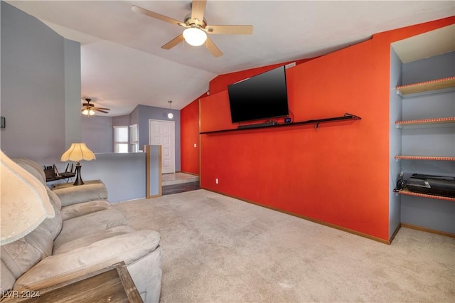 carpeted living room featuring vaulted ceiling and ceiling fan