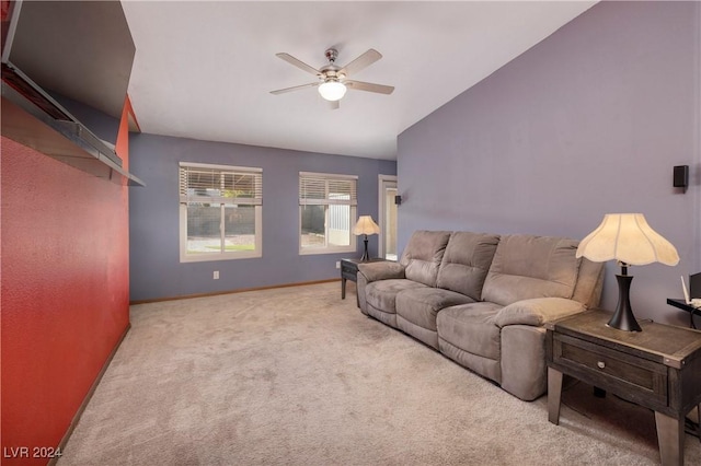 carpeted living room featuring ceiling fan and lofted ceiling