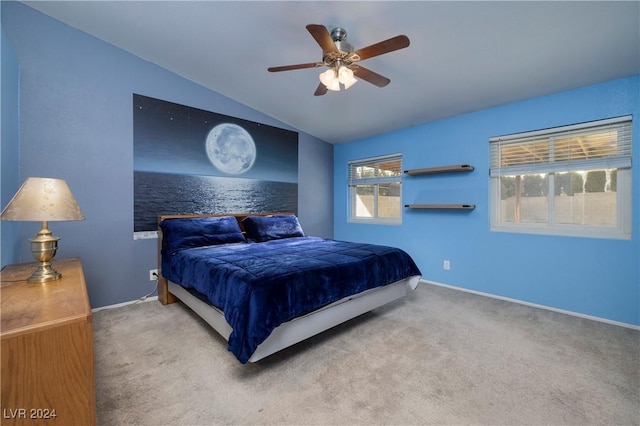 bedroom with light carpet, vaulted ceiling, and ceiling fan