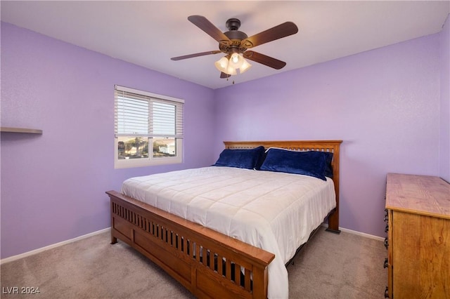 bedroom with light colored carpet and ceiling fan