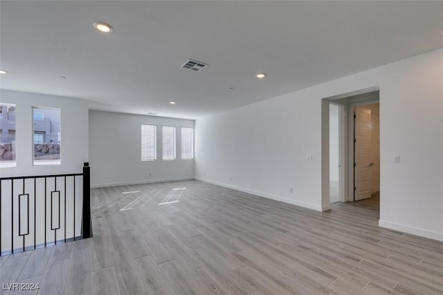 unfurnished room featuring light hardwood / wood-style flooring