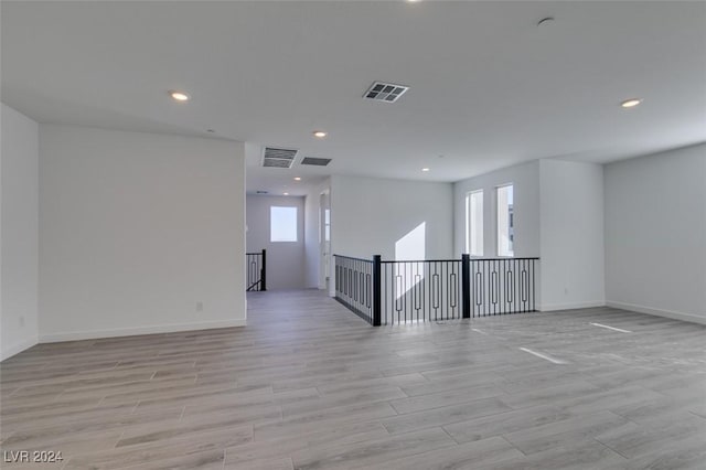 spare room featuring light hardwood / wood-style floors