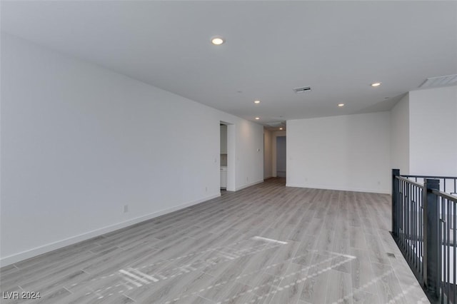 unfurnished room with light hardwood / wood-style flooring