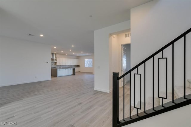 staircase featuring hardwood / wood-style flooring