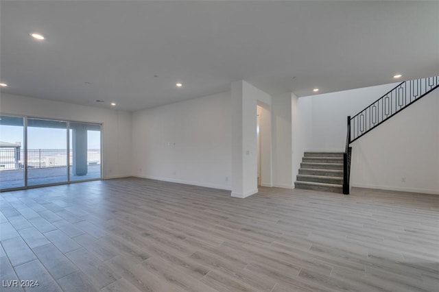 unfurnished living room with light hardwood / wood-style floors