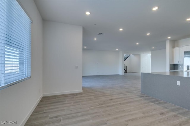 unfurnished room featuring light wood-type flooring