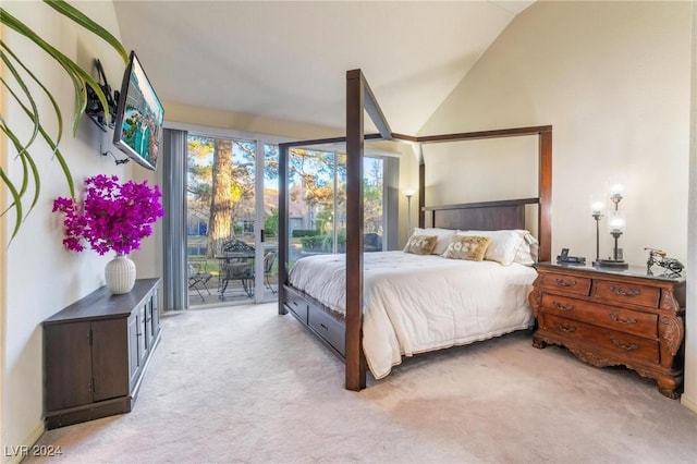 carpeted bedroom featuring access to exterior and high vaulted ceiling