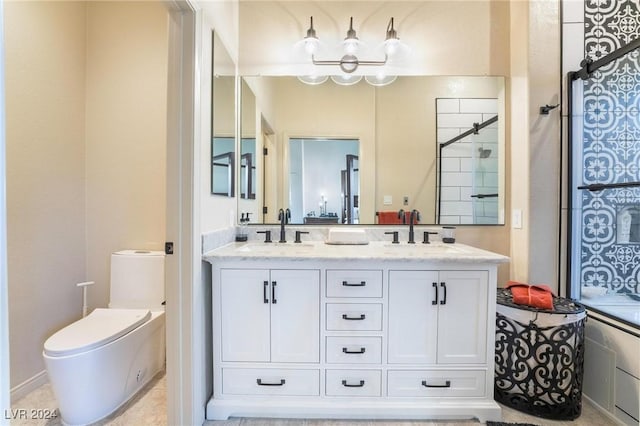 bathroom with vanity, toilet, and a shower with door