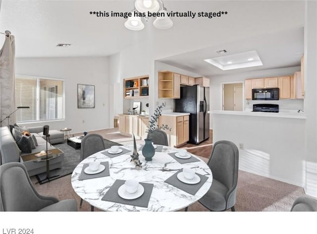 dining space with carpet and vaulted ceiling