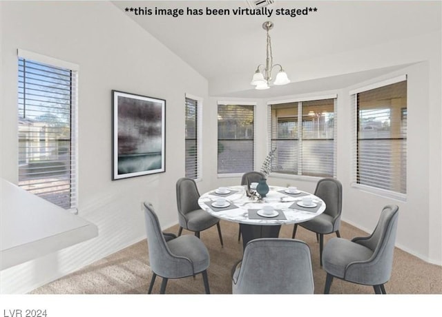 dining space featuring carpet flooring, lofted ceiling, and an inviting chandelier