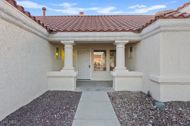 doorway to property with a porch