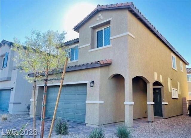 view of front of property with a garage